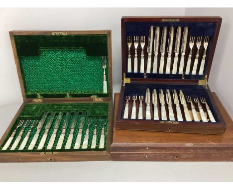 A Set of Twelve Mother of Pearl Handled Dessert Knives and Forks, hallmarked silver ferruled, with decorative etched design t