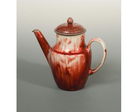 A Ruskin high-fired flambé coffee pot and cover, 1927, with red and white glaze, impressed marks to underside 18.50cm (7in) L