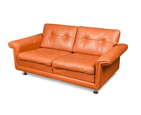 A 1970's Danish two-seater leather sofa finished in cognac leather 49 x 145 x 74cm (19 x 57 x 29in)  