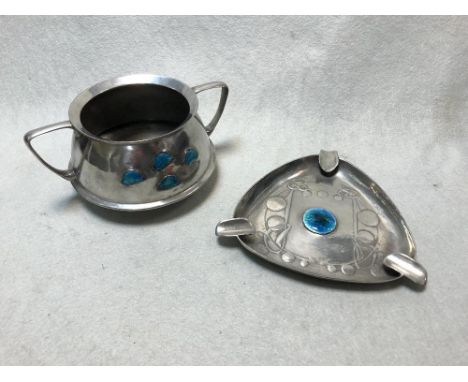 Liberty & Co., a Tudric pewter and enamel ashtray, No. 0898, of tri-form with cast stylised foliate design and central enamel
