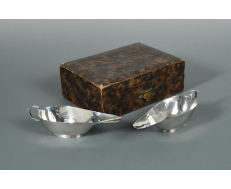 A pair of Art Deco silver asparagus butter boats by S. Blanckensee & Son Ltd., Chester 1937, of oval form with elongated spou