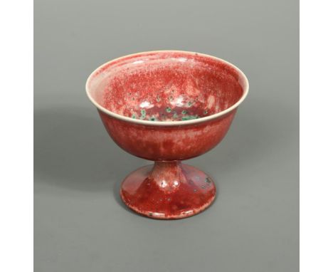 A Ruskin high-fired flambé stem cup, the circular bowl with slightly flared rim raised on a spreading foot, with all over pur