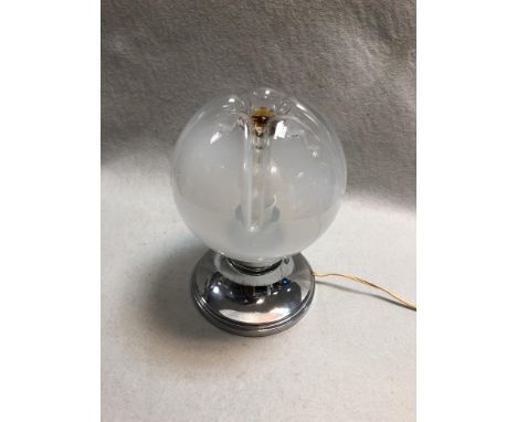 A Murano glass table lamp, the globular shade with amber 'pontil' to top, the chrome base of spreading circular form 23cm (9i