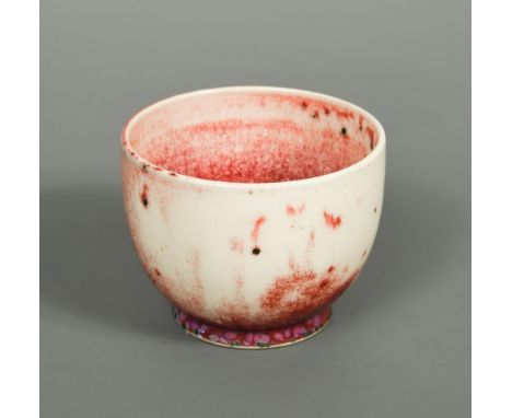 A small Ruskin high-fired flambé bowl, with a mottled and speckled red-purple flambé glaze on an ivory ground, impressed mark