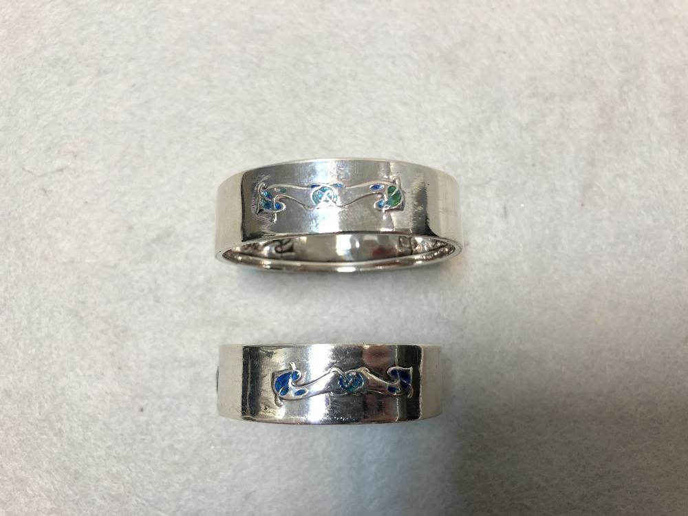 Liberty & Co., two similar silver and enamel napkin rings Birmingham