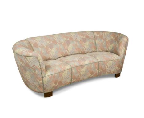 A 1940's Danish Art Deco 'Banana' style three-seater sofa, reupholstered in pastel toned floral fabric 72 x 175 x 90cm (28 x 