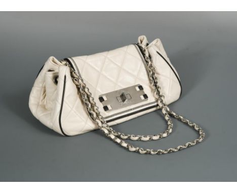 Chanel, a ladies 'East West' Accordion Flap bag, circa 2008, ivory quilted lambskin with black piping detail, with silver ton