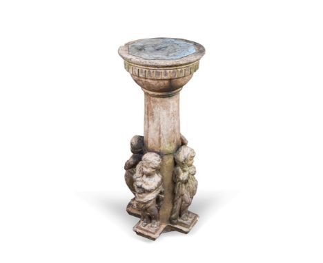 In the manner of Doulton, a stoneware column mounted with a brass sundial, the base of the column with four figures represent