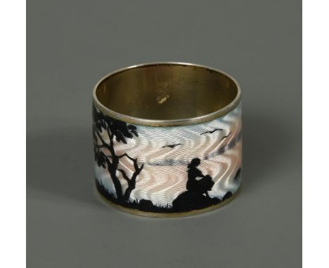 A Norwegian metalwares and enamel napkin ring, decorated with the silhouette of a young girl sat upon a rock looking out to s