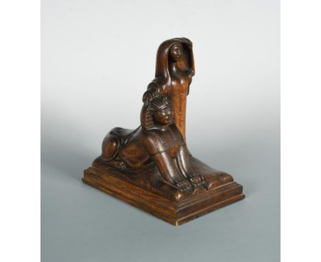 An early 20th century carved wood lamp base modelled as a lady and a sphinx, the top of her head drilled for the light fittin