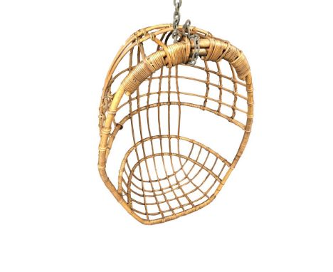 A 1970's wicker hanging chair, with suspension chain 120 x 84 x 50cm (47 x 33 x 20in)  