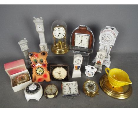 An interesting collection of 9 small clocks to include wall and mantel and alarm models together with 6 small china clocks by