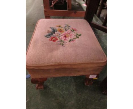 TAPESTRY UPHOLSTERED FOOT STOOL ON CLAW FEET.