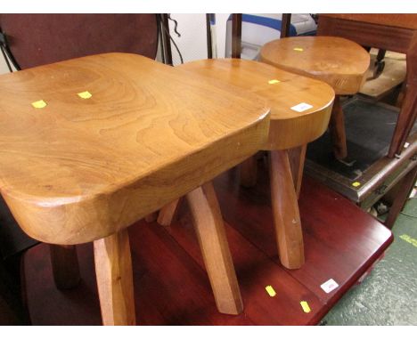 THREE RUSTIC LIGHT WOOD STOOLS.
