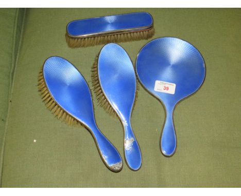 SILVER AND BLUE GUILLOCHE ENAMEL HAND MIRROR AND THREE BRUSHES.