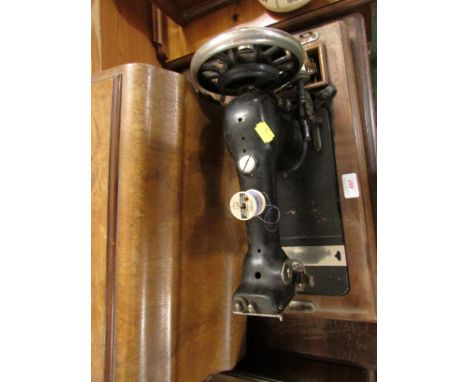 MANUAL SEWING MACHINE WITH WOODEN CASE, AND A MAHOGANY TOPPED TREADLE SEWING TABLE WITH CAST IRON BASE. (AF)