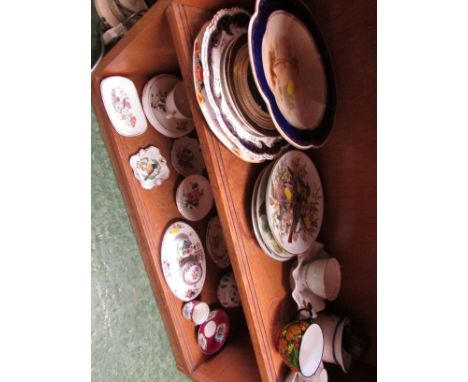 TWO SHELVES OF DECORATIVE CHINA. INCLUDING DISPLAY PLATES , PIN DISHES, CUPS AND SAUCERS.