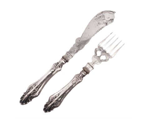Pair of Victorian silver fish servers, with naturalistic silver handles, each engraved with a dolphin design and the crest of
