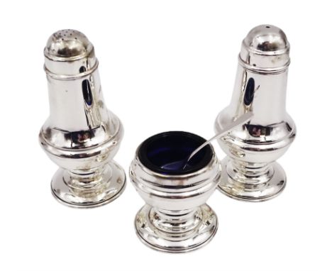 Modern silver three piece cruet set, comprising salt shaker, pepper shaker and mustard pot and spoon, all of slightly waisted