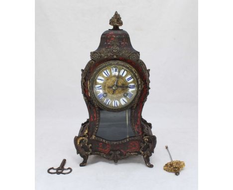 A late 19th/early 20th century French 'Boulle' clock with brass mounts and Japy Frères movement. 30cm high.
