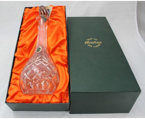A 'Mayfair' lead crystal decanter of ovod form with tall neck, cut lozenge decoration, in fitted box
