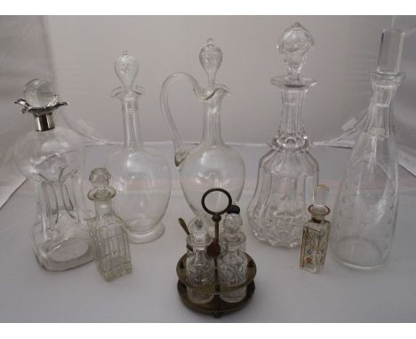 A silver mounted glass cluck cluck decanter, together with four other glass decanters and a small quantity of other glass bot