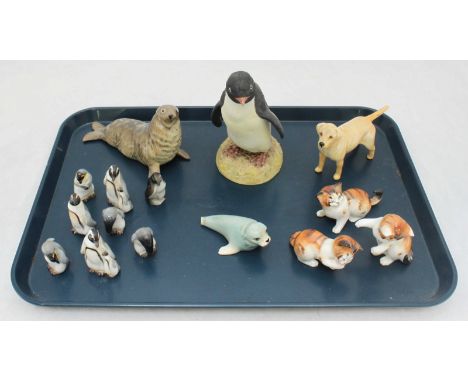 A collection of ceramic animals including a Beswick dog, a set of Royal Doulton penguins and a Beswick seal etc. (15)