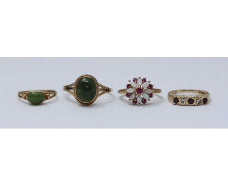 Two 9ct gold and ruby rings, together with two 9ct gold and jade rings, 7.17 gross