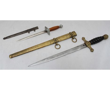 A German Kriegsmarine dagger, with stained handle (lacking wire binding), brass scabbard, Quillon and Pommel, together with a