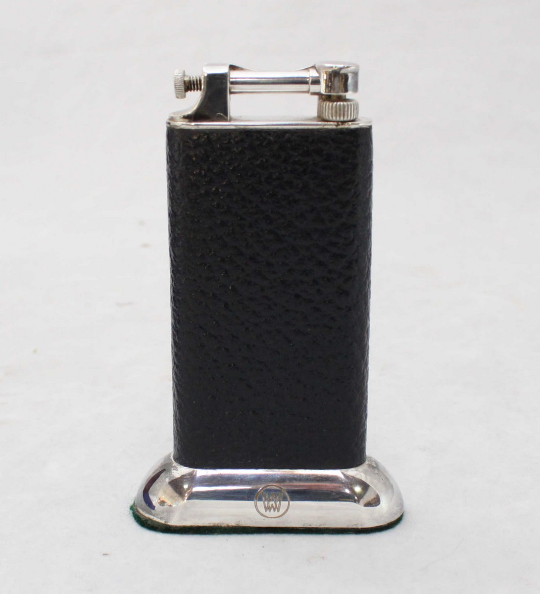 A silverplated Dunhill table lighter, in original box. Reg no. 737418