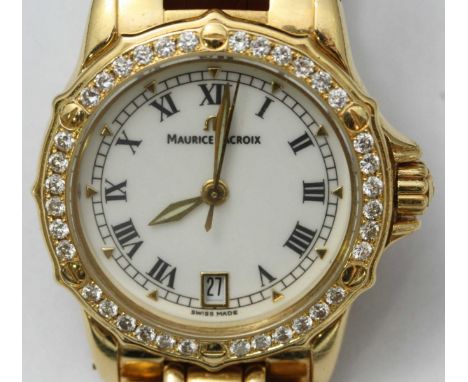 A Maurice Lacroix ladies 18ct gold wristwatch, white enamel dial with Roman numerals, calendar at 6 o'clock, the bezel set wi