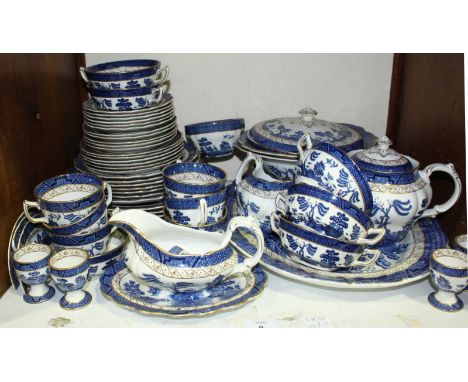 SECTION 9. A Booths 'Real Old Willow' pattern part tea and dinner service, comprising of meat plates, egg cups, cups and sauc
