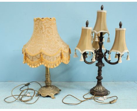 A patinated metal four-light electric candelabrum and a brass table lamp, both fitted with 2-amp 3-pin plugs