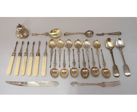 An assortment of silver flatware including a set of six ivory handled nut picks by Henry Atkin, together with various teaspoo