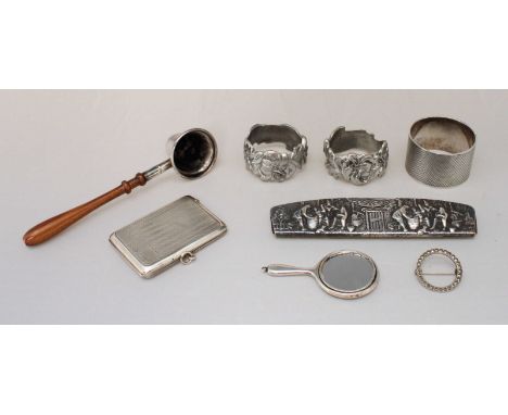 A silver matchbook cover, Birmingham, 1923, silver napkin ring, Sheffield, 1943, (both engine-turned), and silver candle snuf