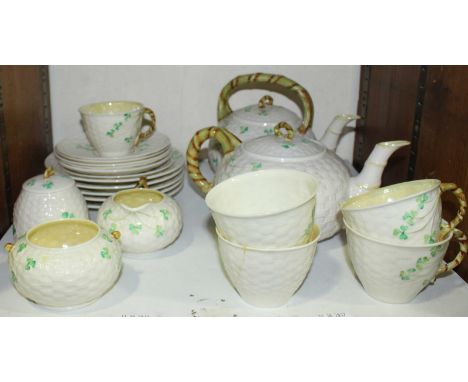 SECTION 25. A twenty-two piece Belleek porcelain tea-set comprising of two teapots, cups, saucers and jug etc.