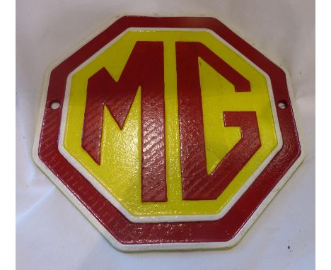Cast iron MG hexagonal wall plaque, D: 24 cm. P&amp;P Group 1 (£14+VAT for the first lot and £1+VAT for subsequent lots) 