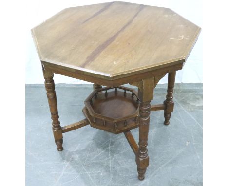 A 19th century walnut octagonal table, having turned supports and galleried lower shelf, 76 x 76 x 69 cm H, scratches to top,