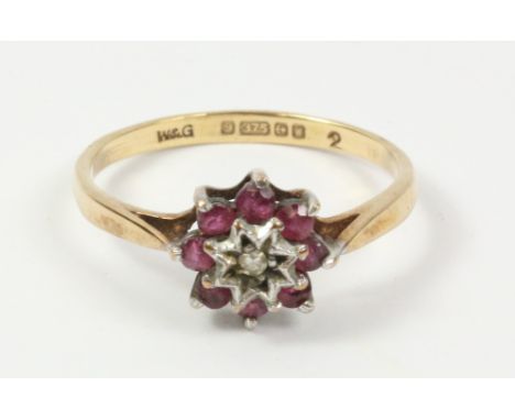 Ruby and diamond cluster ring hallmarked 9ct   Condition Report   Click here for further images, condition, auction times & d