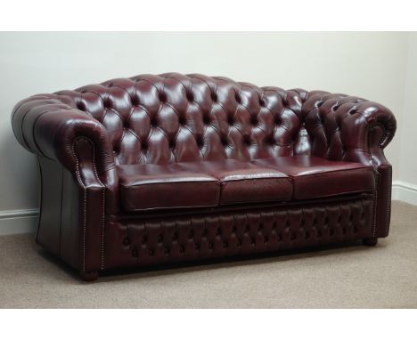 Three seat Chesterfield sofa upholstered in burgundy deeply studded leather, W195cm   Condition Report   Click here for furth