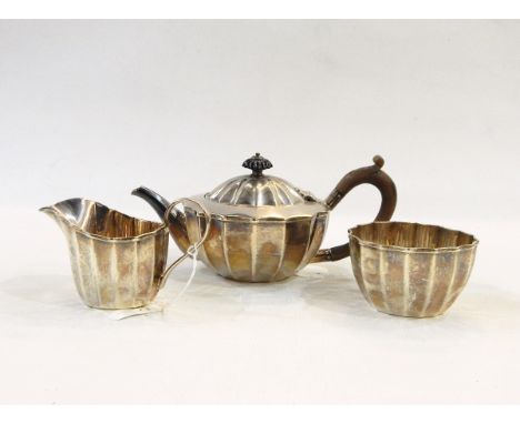 Victorian silver bachelor's three piece tea set of fluted form, comprising teapot, cream jug and sugar bowl, London 1893/94, 