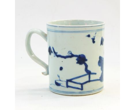 Chinese porcelain Nanking Cargo cylindrical mug, sold by Christie's, painted with flowers, tree and fence in underglaze blue,