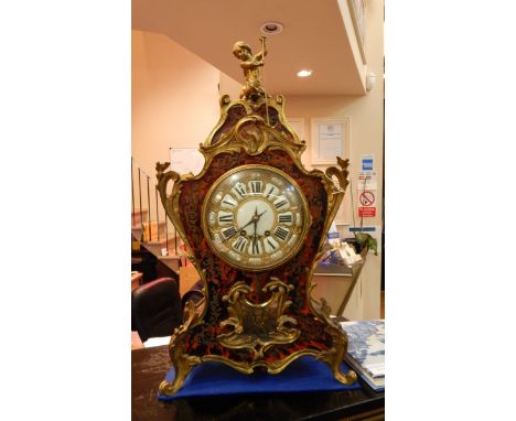 French rococo style boulle and ormolu mounted mantel clock having cherub holding boat hook astride a fish finial, the eight-d