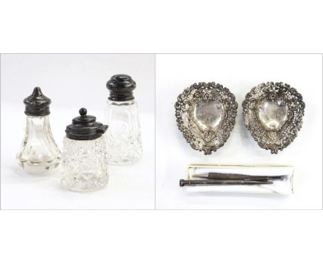 Pair of late Victorian silver pin dishes of heart-shape with pierced borders, three cut glass condiments with silver mounts a