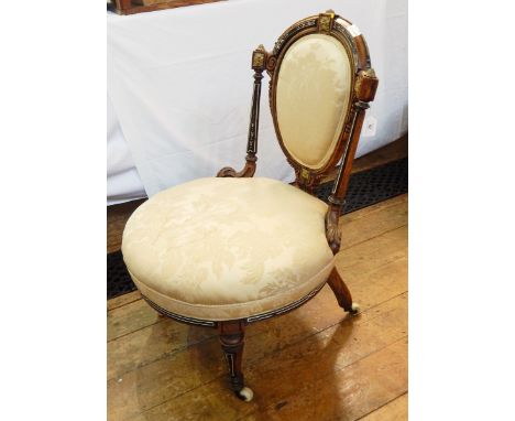 Late 19th/early 20th century mahogany drawing room chair with oval back, beaded edges and floral carved decoration flanked by