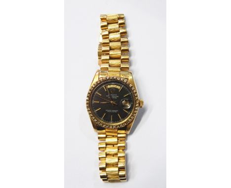 Gentleman's 18K gold and diamond Rolex Oyster perpetual day/date superlative chronometer bracelet watch, the blue dial with b