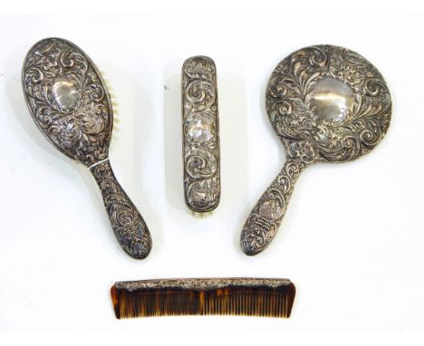 20th century four-piece silver dressing table set comprising hand mirror, hair brush, clothes brush and comb, Birmingham 1951