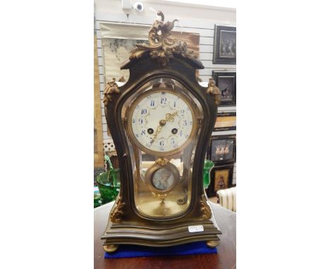 Late 19th century Japy Freres brass and ormolu mounted mantel clock of rococo style, with enamel dial, blue aerobic numerals,