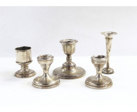 Pair of silver dressing table candlesticks of plain circular form, a single silver candlestick with ribbon borders, silver tr