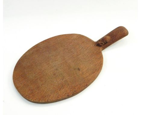 Robert Thompson of Kilburn Mouseman oak cheese board of oval form with carved mouse signature to handle, 39cm overall length